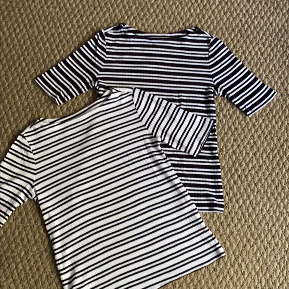 2 black and white 3/4 sleeve shirts